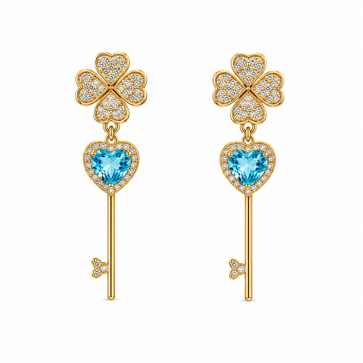 Gold earrings with clover and heart designs on a white background