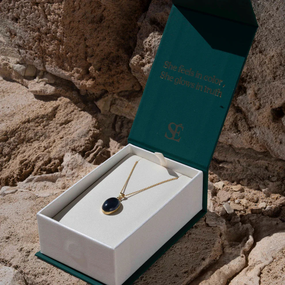 18k gold necklace with small oval mood stone pendant