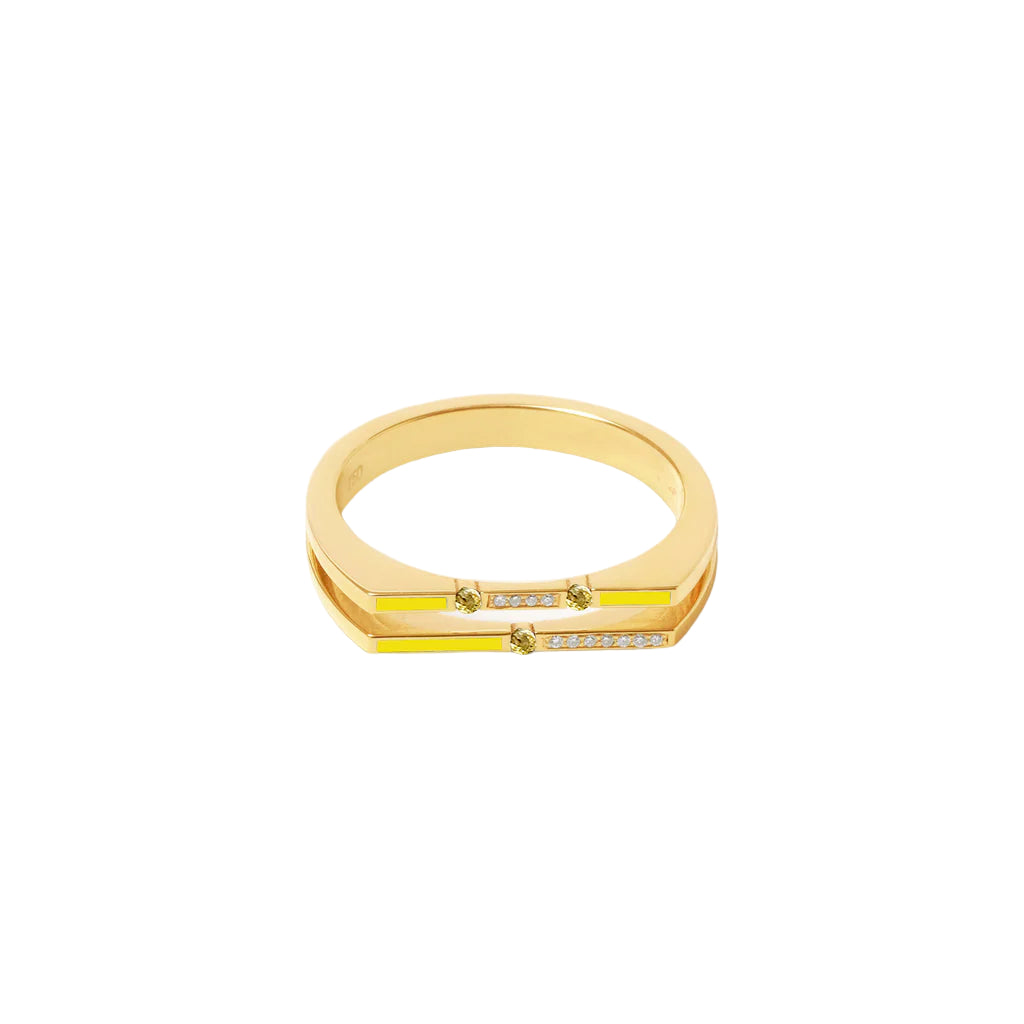 Gold ring with a yellow accent on a white background