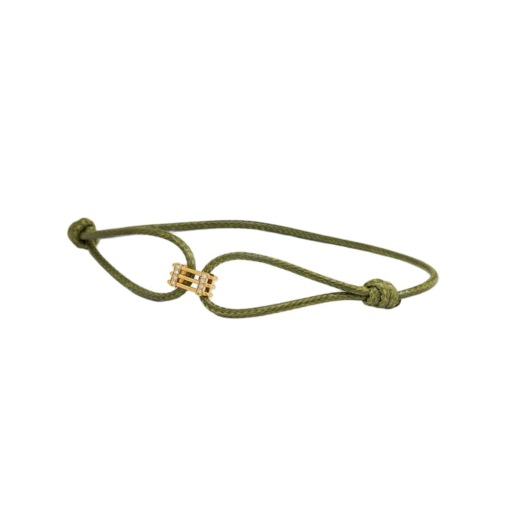 Green bracelet with a gold clasp on a white background