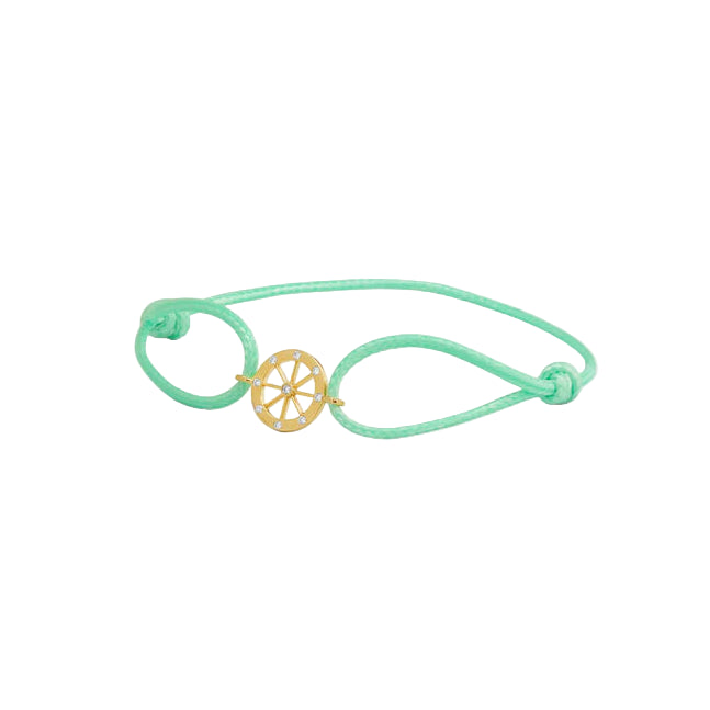 Green bracelet with a gold charm on a white background