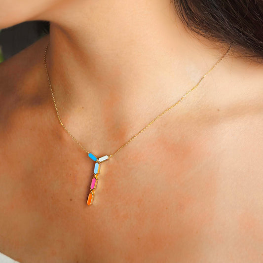 Necklace with colorful pendant on a person's neck