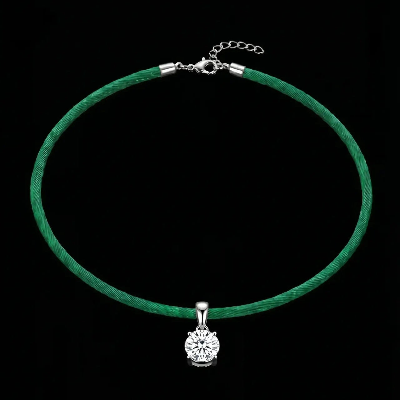 Green satinchoker necklace with a silver pendant on a black background