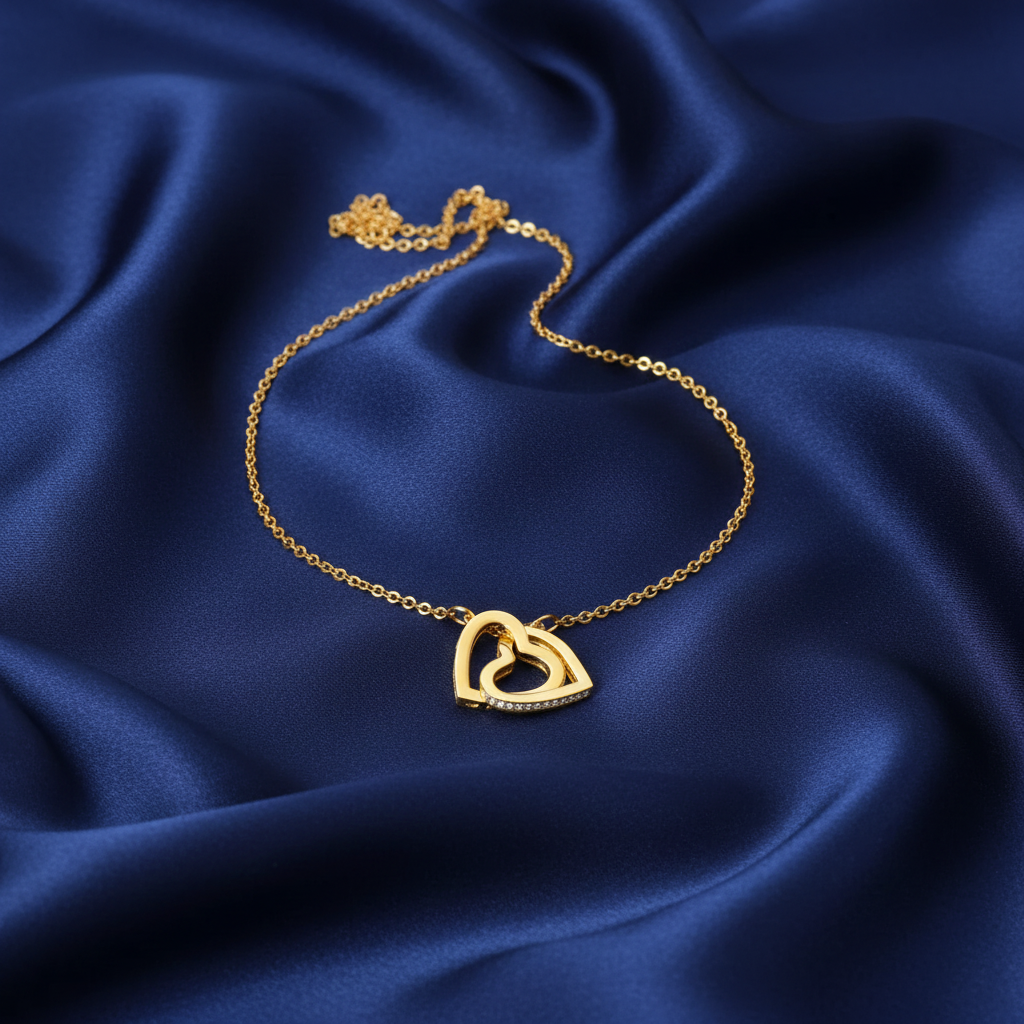 Entwined Necklace in yellow gold, full view on blue satin