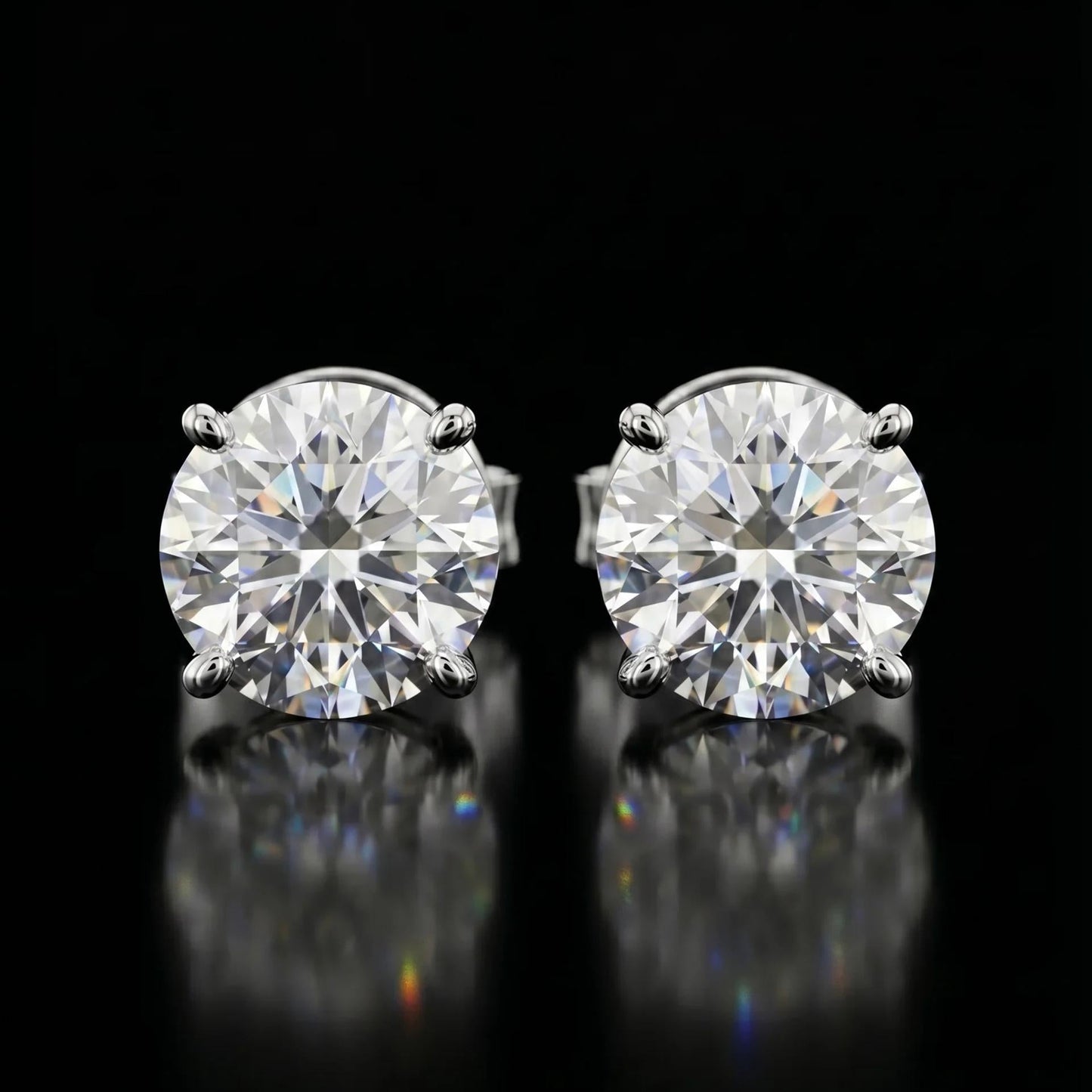 Pair of diamond stud earrings on a black background