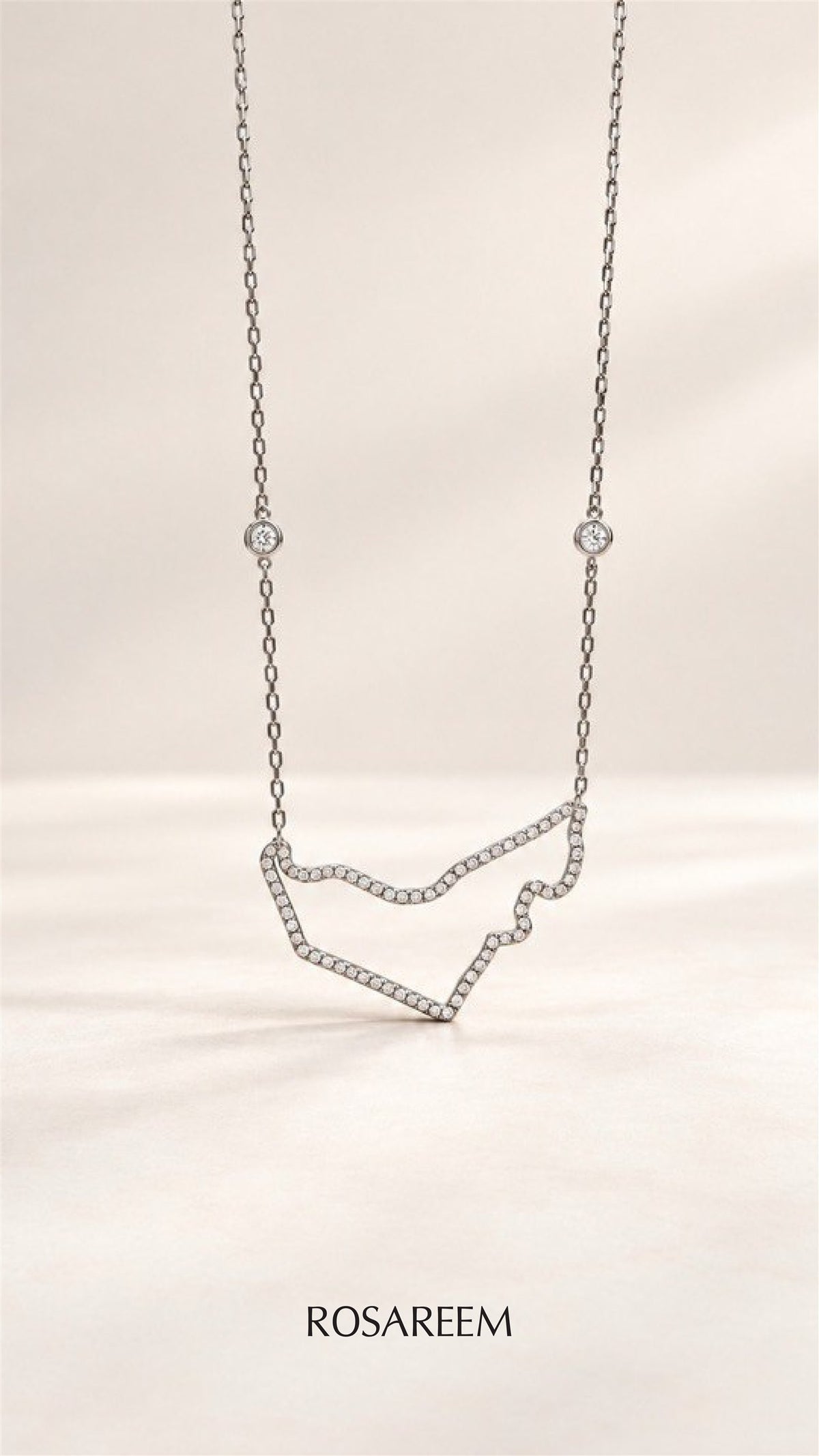 RosaReem Love UAE Necklace on neutral background
