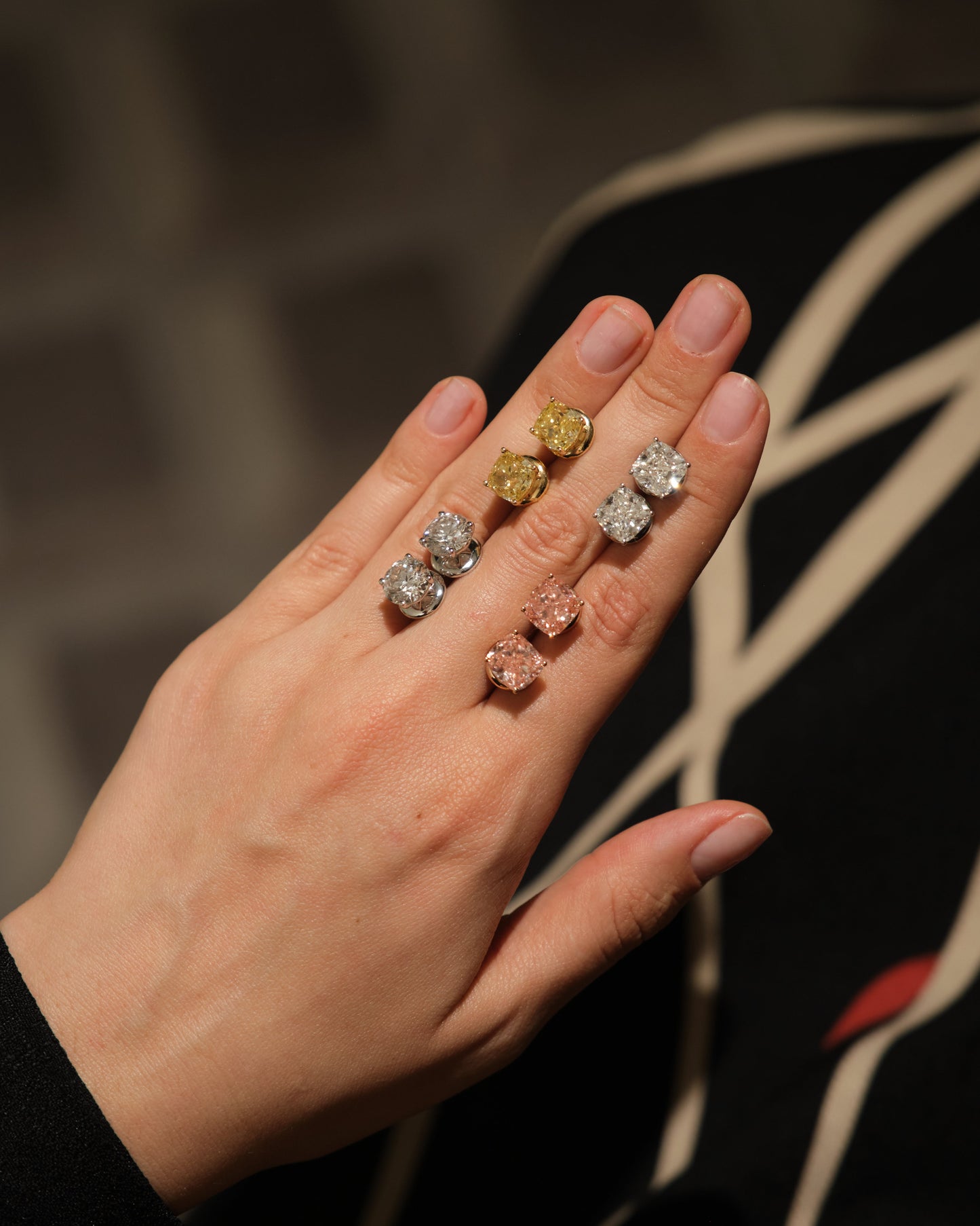 Verbesa Atelier cushion-cut lab-grown diamond stud earrings displayed on the hand