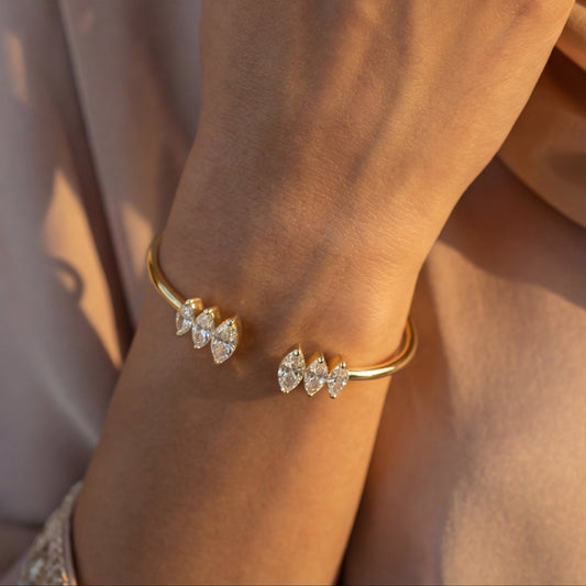 White Drop marquise open cuff worn in an original lifestyle image