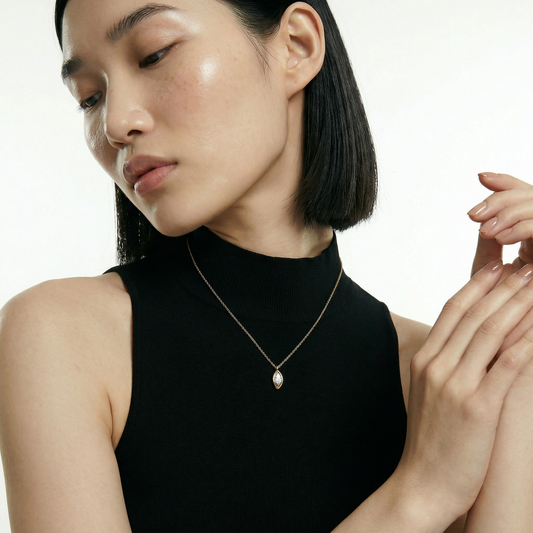 ZORÁE Core Axis 18K yellow gold necklace worn on model