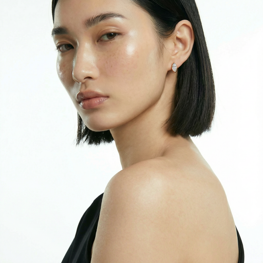 ZORÁE Core Axis Studs 18K yellow gold earrings worn on model