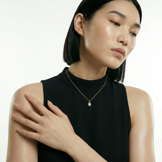 ZORÁE Core Frame 18K yellow gold necklace worn on model