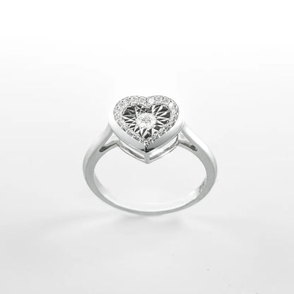 Heart-shaped diamond ring on a white background