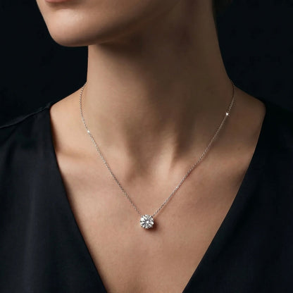 Close-up of a necklace with a diamond necklace on a black background