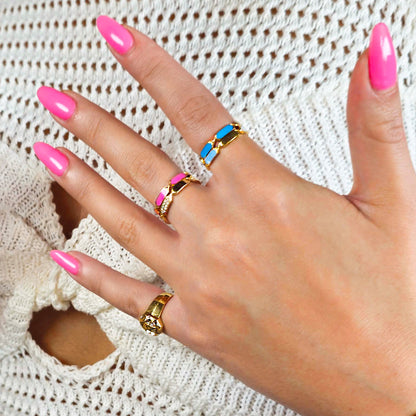 18k gold ring with rotating orange and pink enamel design, additional view