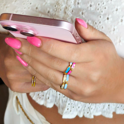 18k gold ring with rotating orange and pink enamel design, additional view