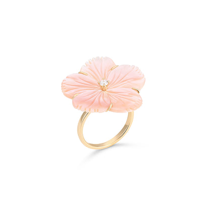 Pink floral ring with gold accents on a white background