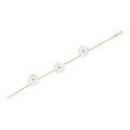 18K yellow gold Trio Star Bracelet with mother-of-pearl flowers and ruby centers, additional view