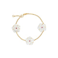 18K yellow gold Trio Star Bracelet with mother-of-pearl flowers and ruby centers