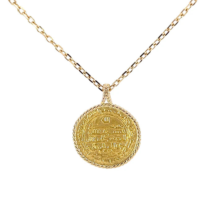 Gold necklace with a detailed coin pendant on a white background