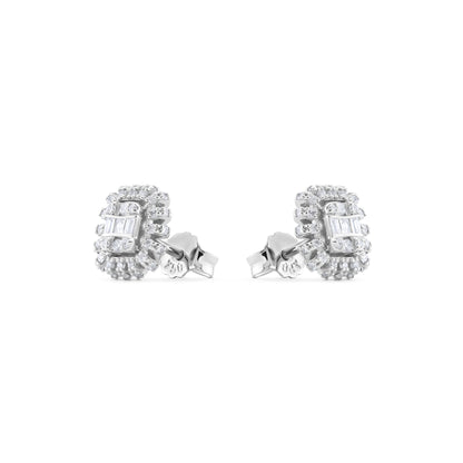 Pair of white gold earrings with gemstones on a white background