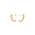 Gold hoop earrings on a white background