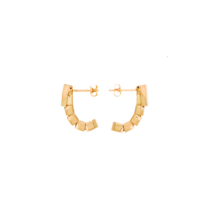 Gold hoop earrings on a white background