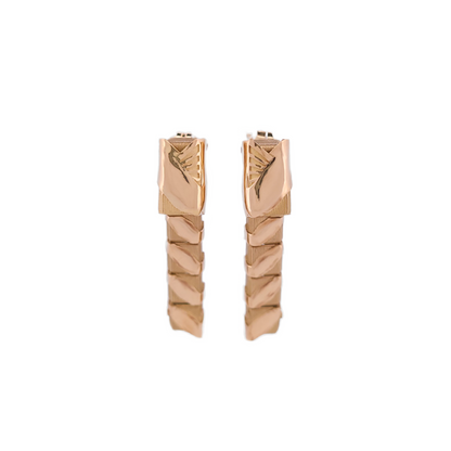 Pair of gold hoop earrings on a white background