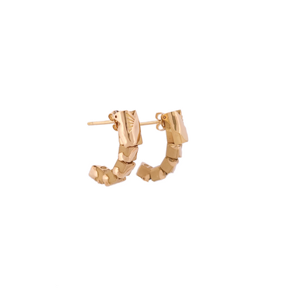 Gold hoop earrings on a white background