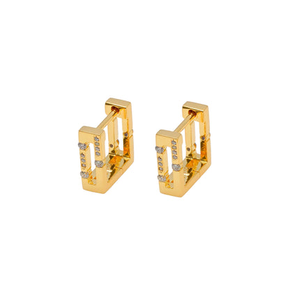 Pair of gold hoop earrings with small diamonds on a white background