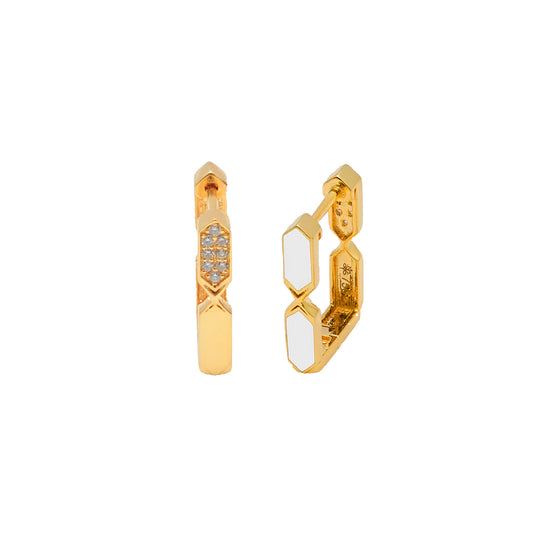 Gold hoop earrings with white stones on a white background
