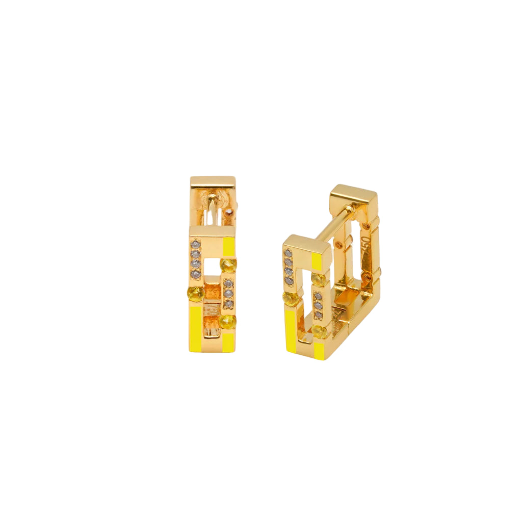 Gold hoop earrings with small stones on a white background