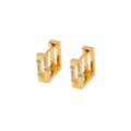 Gold hoop earrings with embedded stones on a white background
