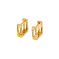Gold hoop earrings with small diamonds on a white background