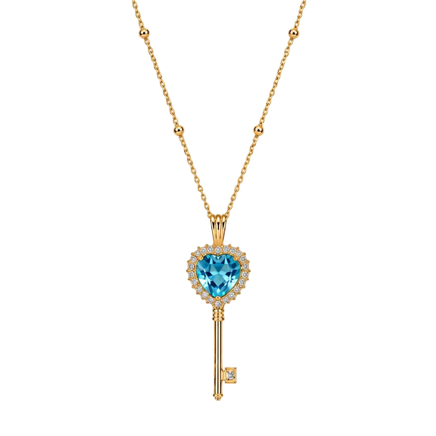 Gold key-shaped necklace with a blue gemstone on a white background