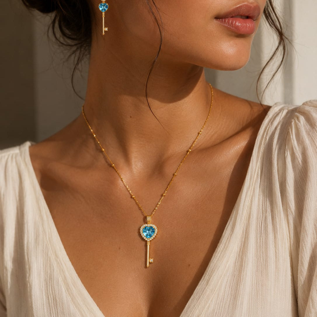 18k gold key-shaped necklace with blue topaz, additional view