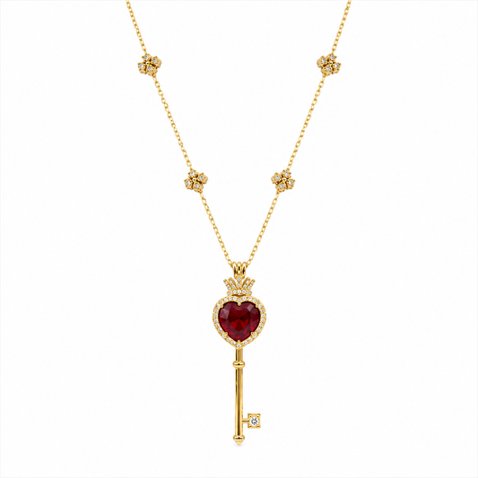 18k gold key-shaped necklace with ruby