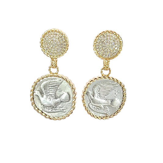 Pair of earrings with gold and silver designs on a white background