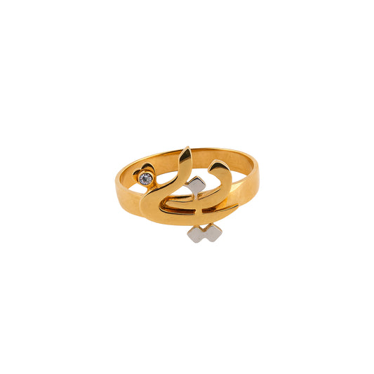 Gold ring with musical note design on a white background