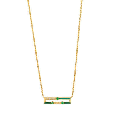 Gold necklace with green gemstones on a white background