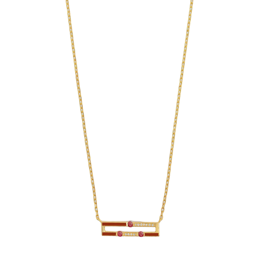 Gold necklace with red and white accents on a white background