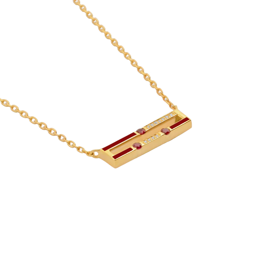 Gold necklace with a rectangular pendant on a white background