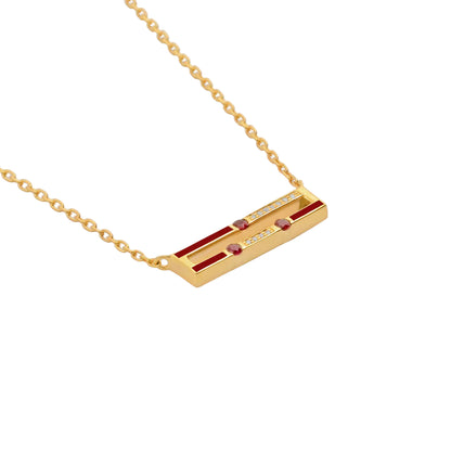 Gold necklace with a rectangular pendant on a white background
