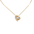 Gold necklace with a heart-shaped pendant on a white background