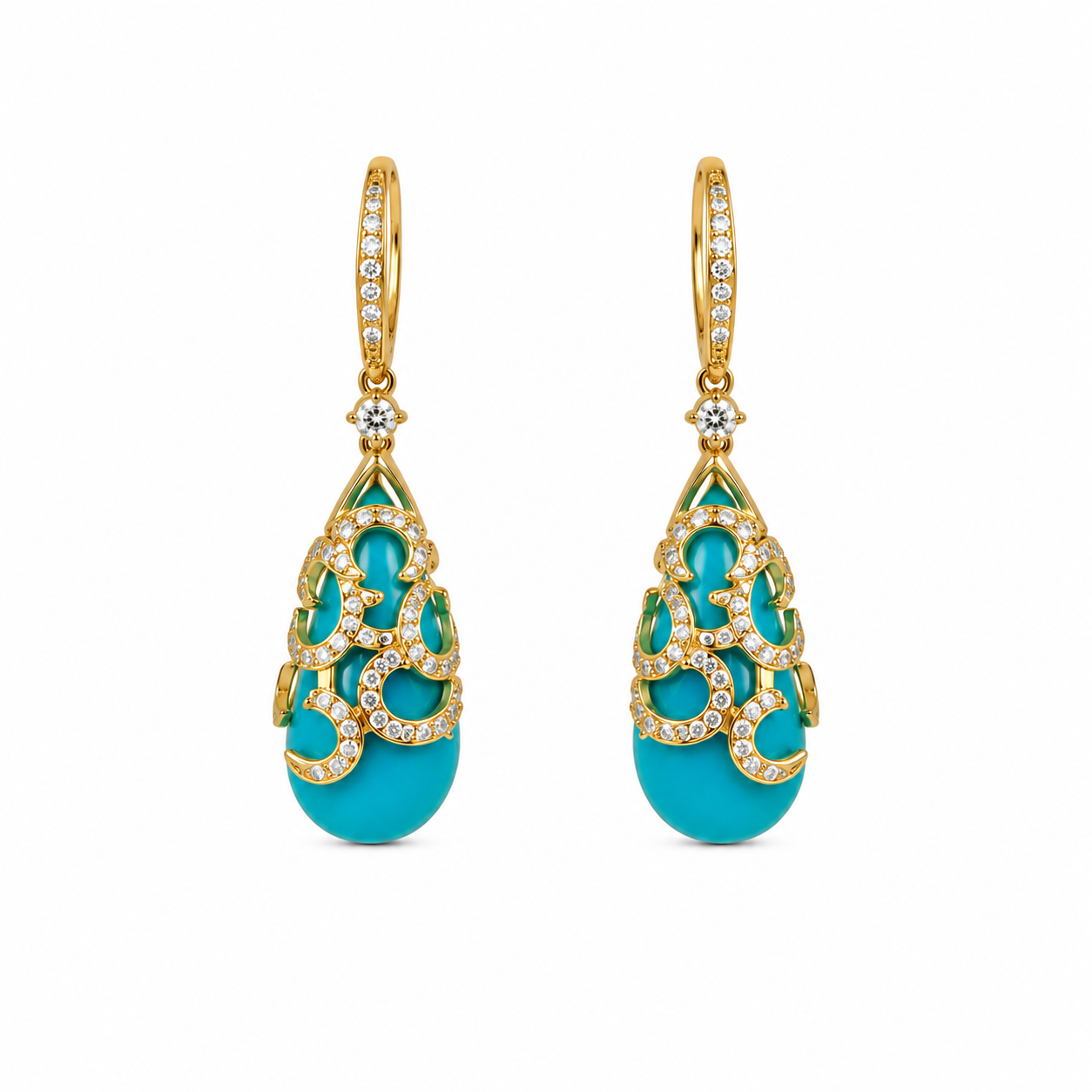 Pair of turquoise earrings with gold and diamond accents on a white background