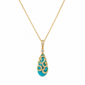 Gold necklace with a turquoise pendant on a white background