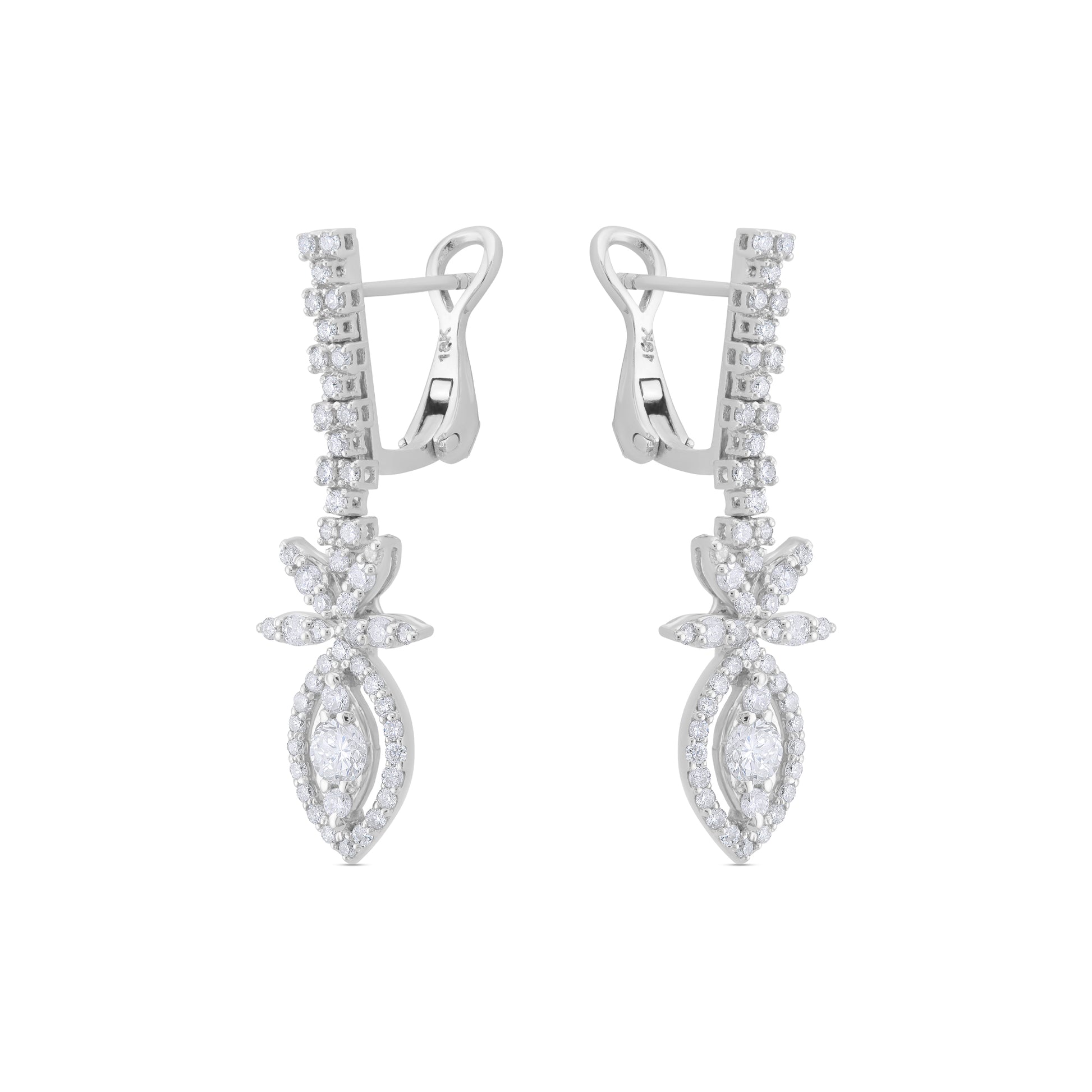Pair of white gold earrings with diamond-like stones on a white background