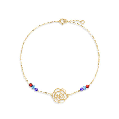 Gold bracelet with a floral design and colorful beads on a white background