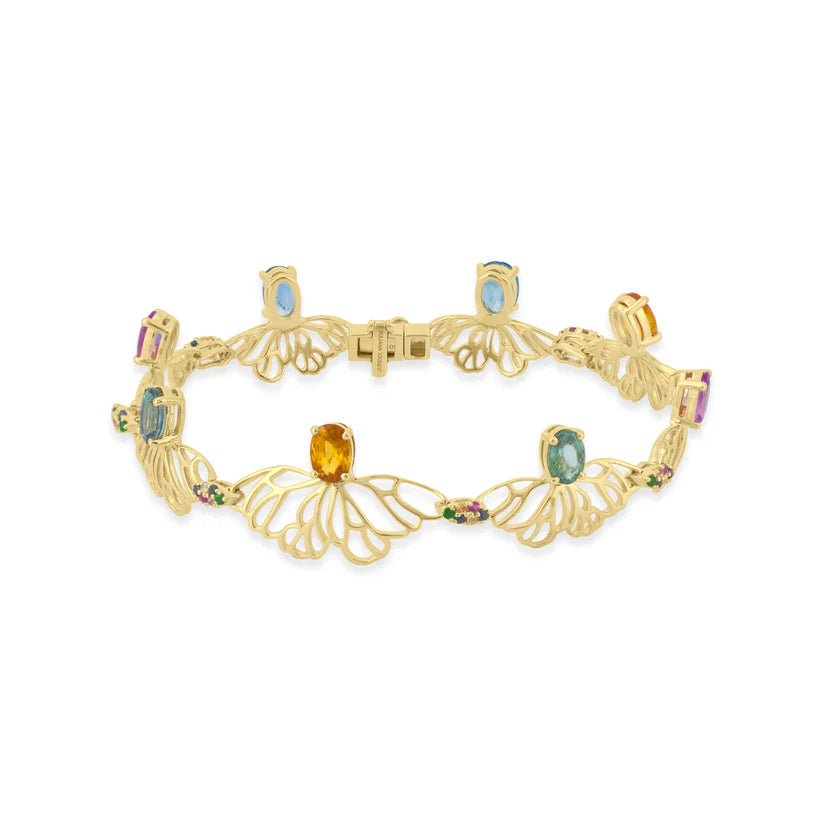 Gold bracelet with gemstones on a white background