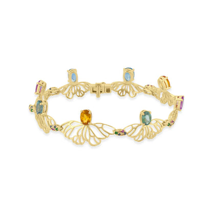 Gold bracelet with gemstones on a white background