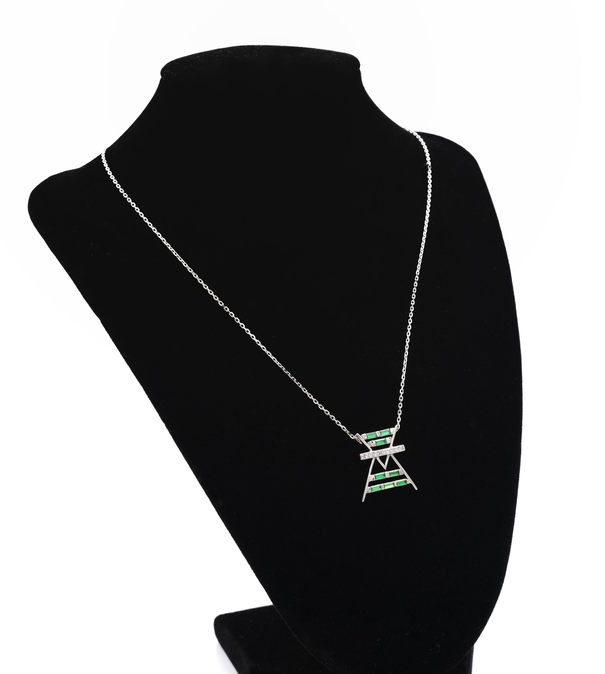 Necklace with a pendant on a black mannequin bust